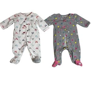 2 Carter’s footie pajama set Newborn